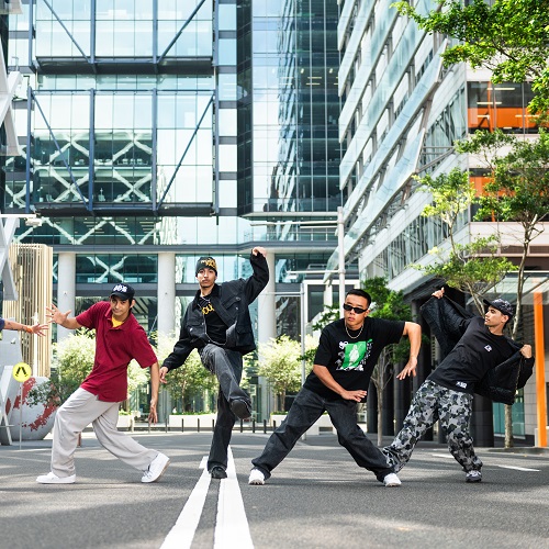 Photo of Stale Biskitz dancers mid pose on the street
